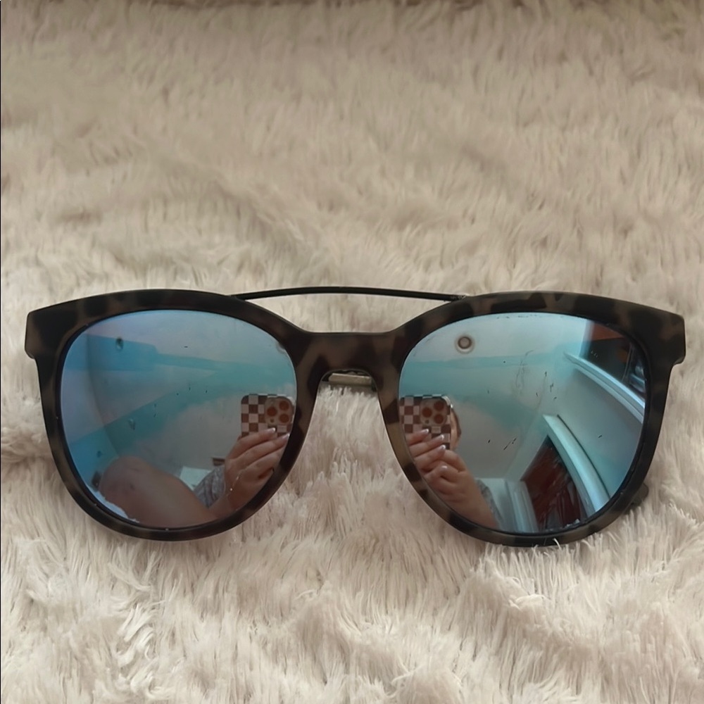 Stylish electric California brand Sunglasses with blue lenses
